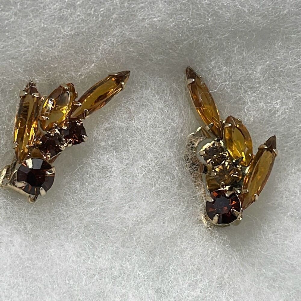 Vintage amber colored glass climber earrings.
